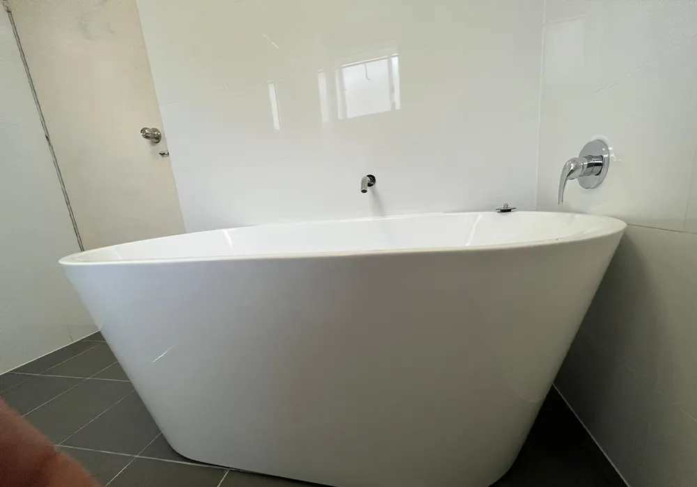 Bathroom and Kitchen Renovation in Pagewood, free standing bath tub, white gloss wall tiles, grey floor tiles, silver tap ware, chrome tap ware, bathroom renovation