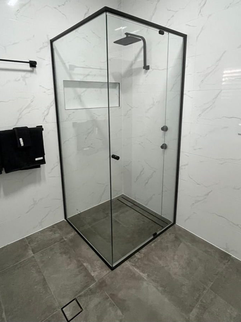 Shower Screens, black shower screen, semi frameless shower screen, white wall tiles, marble wall tiles, grey floor tiles